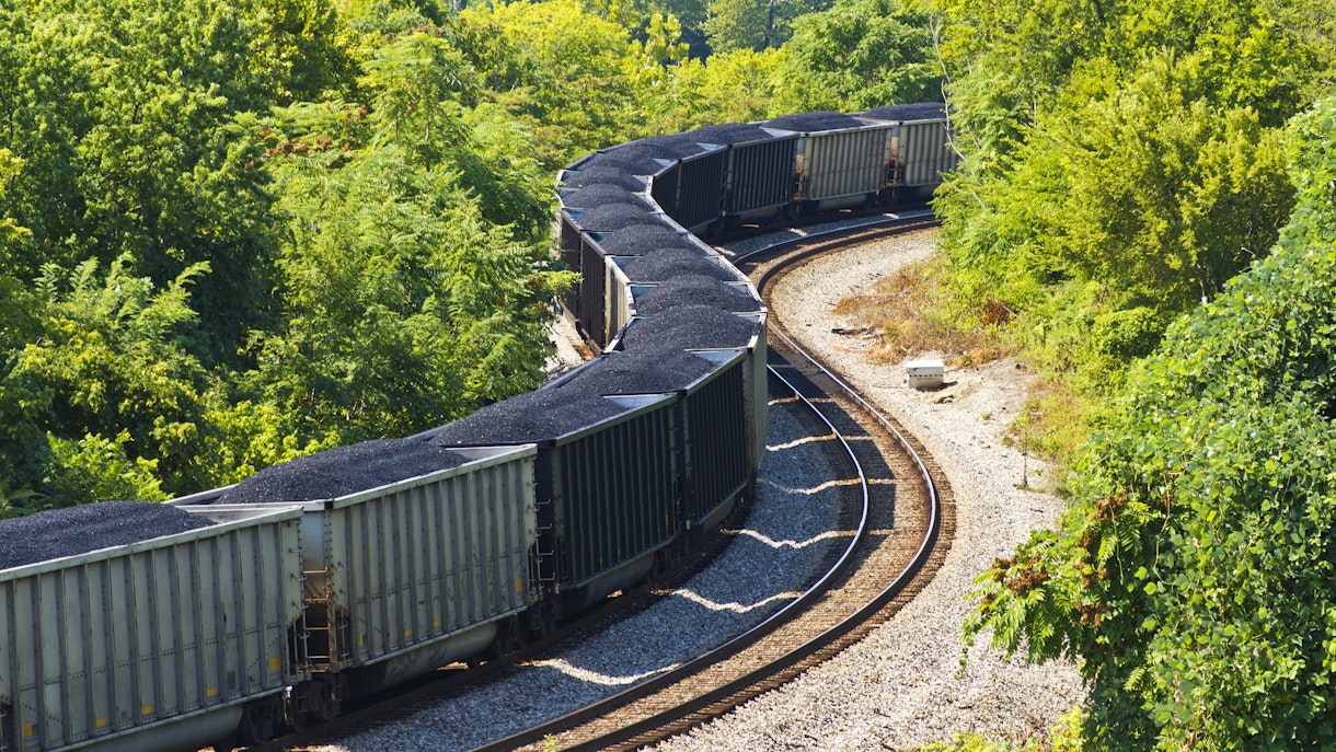 Photograph of a coal train through a forest